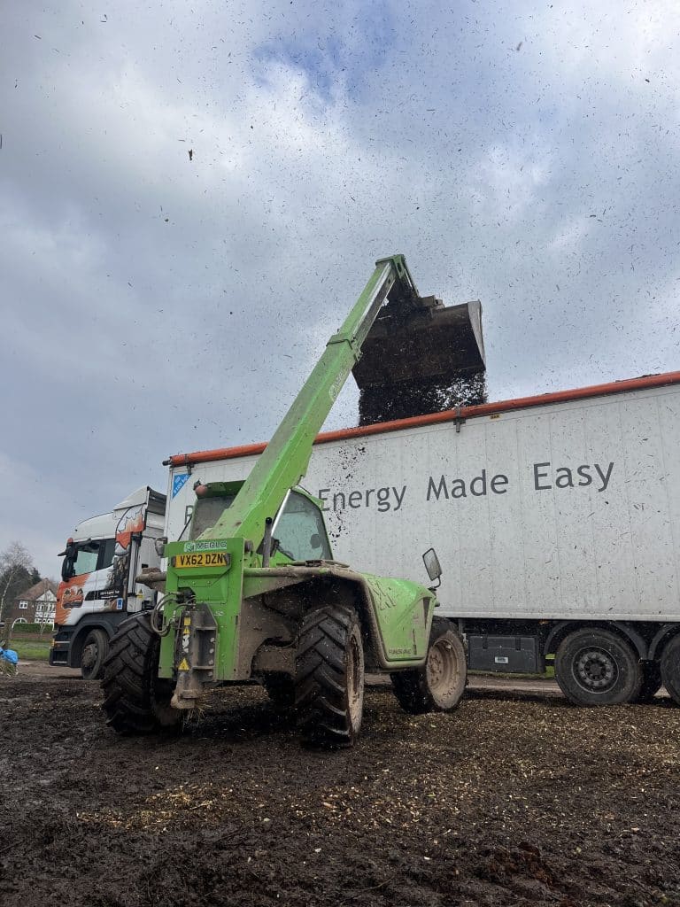loading vegetation and forestry mulch into lorry